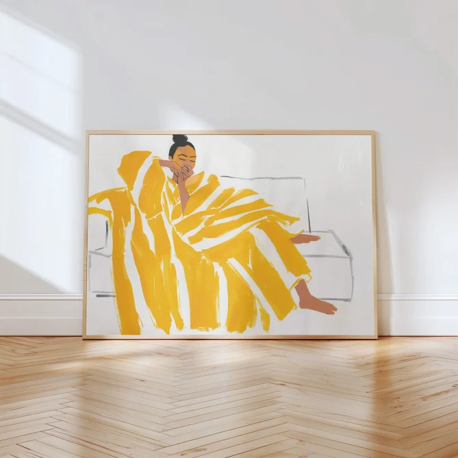 Alternative view of Woman Wrapped in Yellow Striped Blanket on Sofa